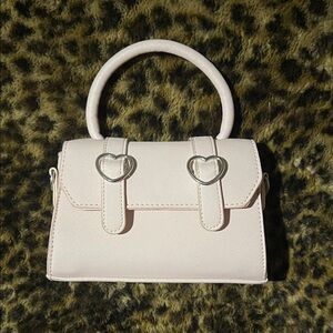 Elegant Pink Handbag with Heart Accents